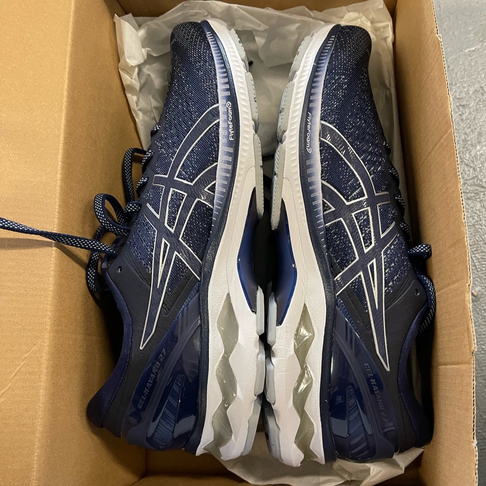 Never worn navy ASICS men’s sneakers. Left size 10, right size 10.5